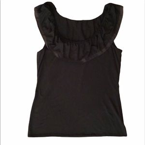 Black knit ruffled top can be worn off shoulders